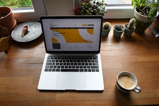 macbook pro on brown wooden table