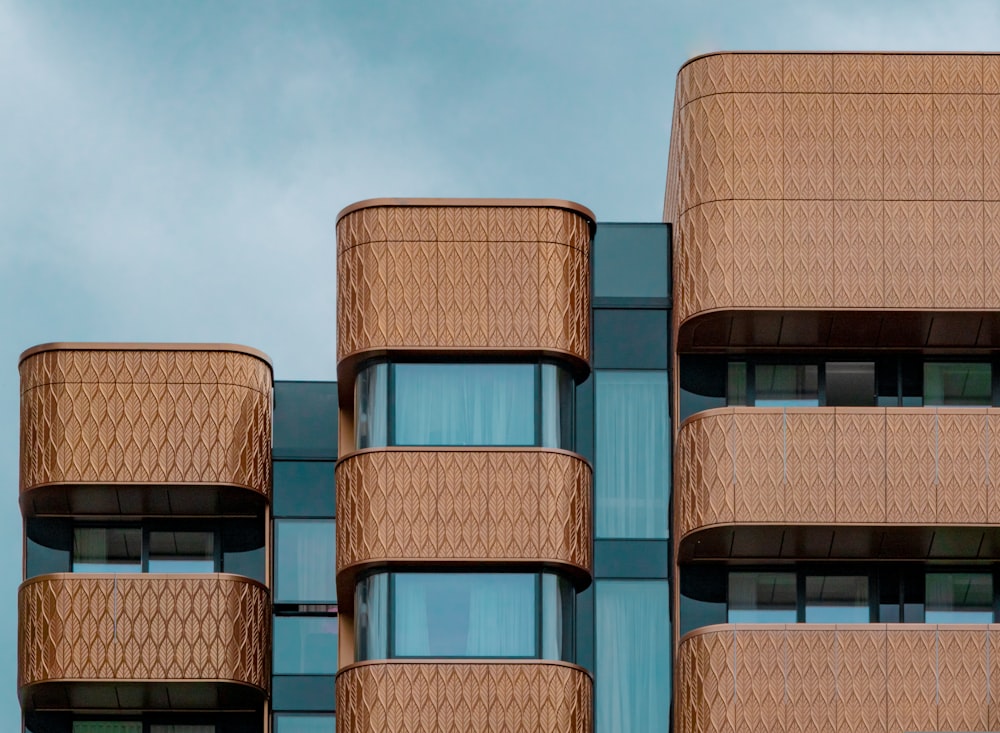 a very tall building with many balconies on it