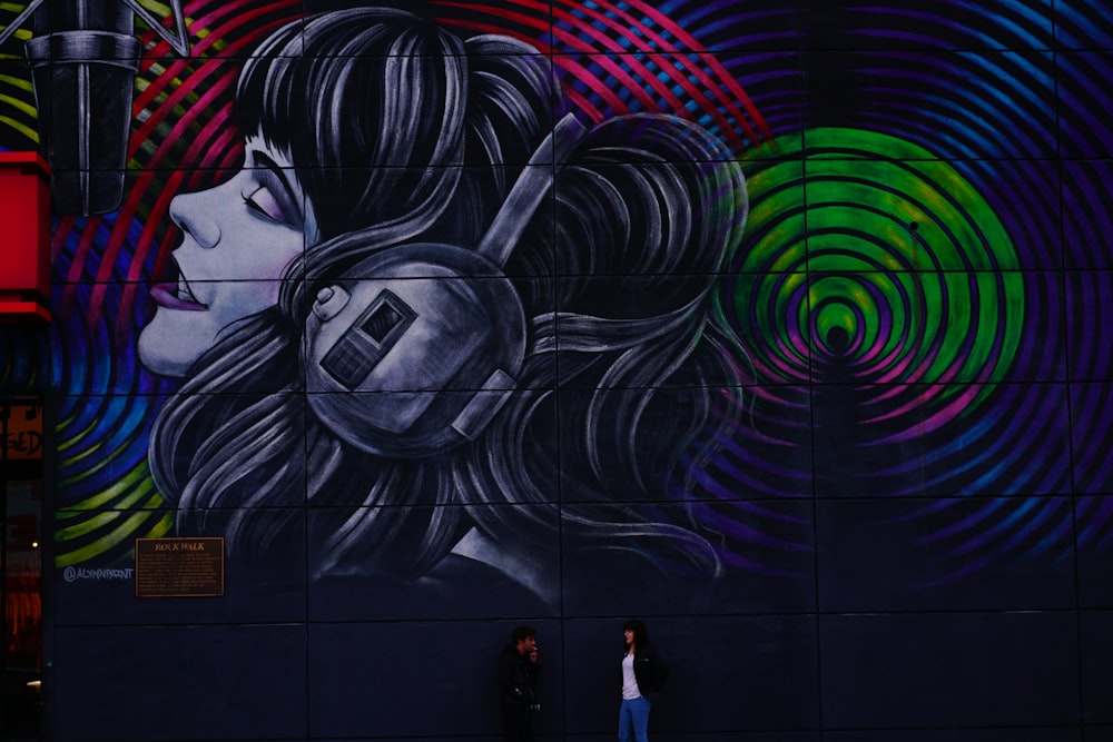 a mural of a woman with headphones on