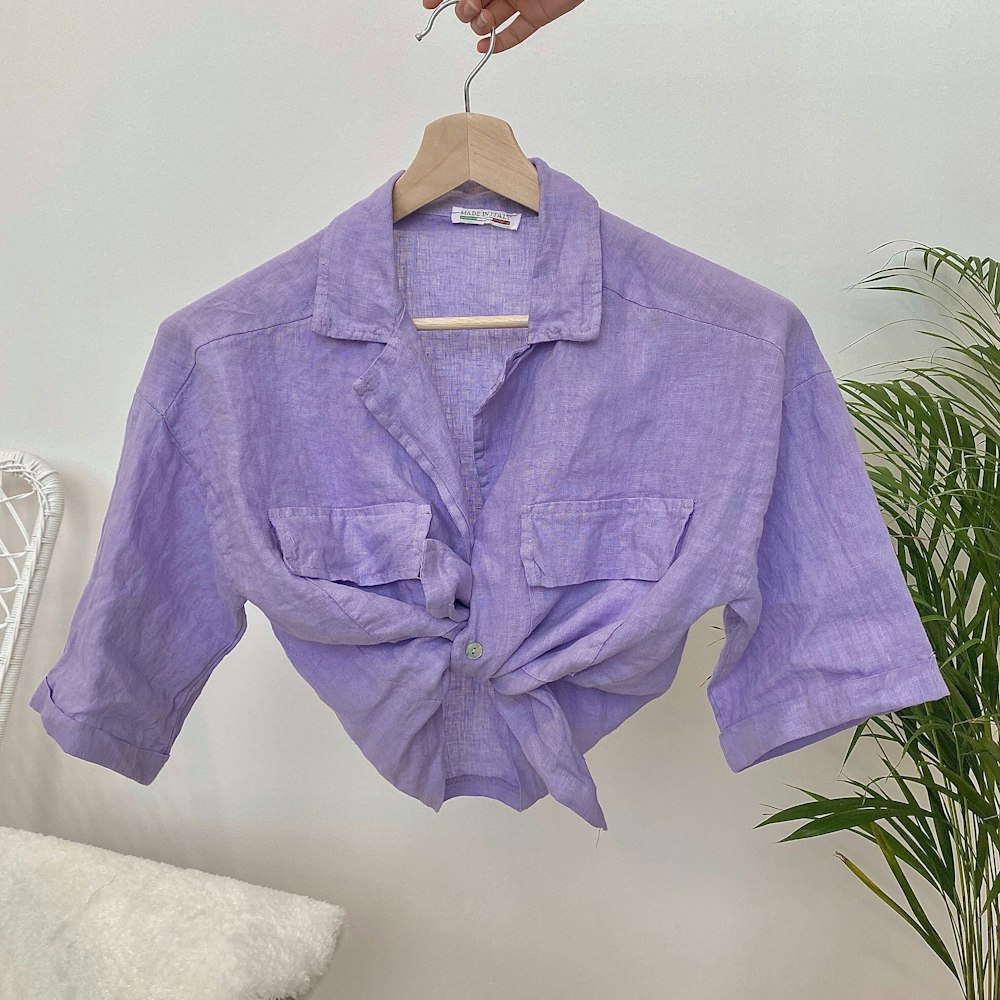 a purple shirt hanging on a clothes line