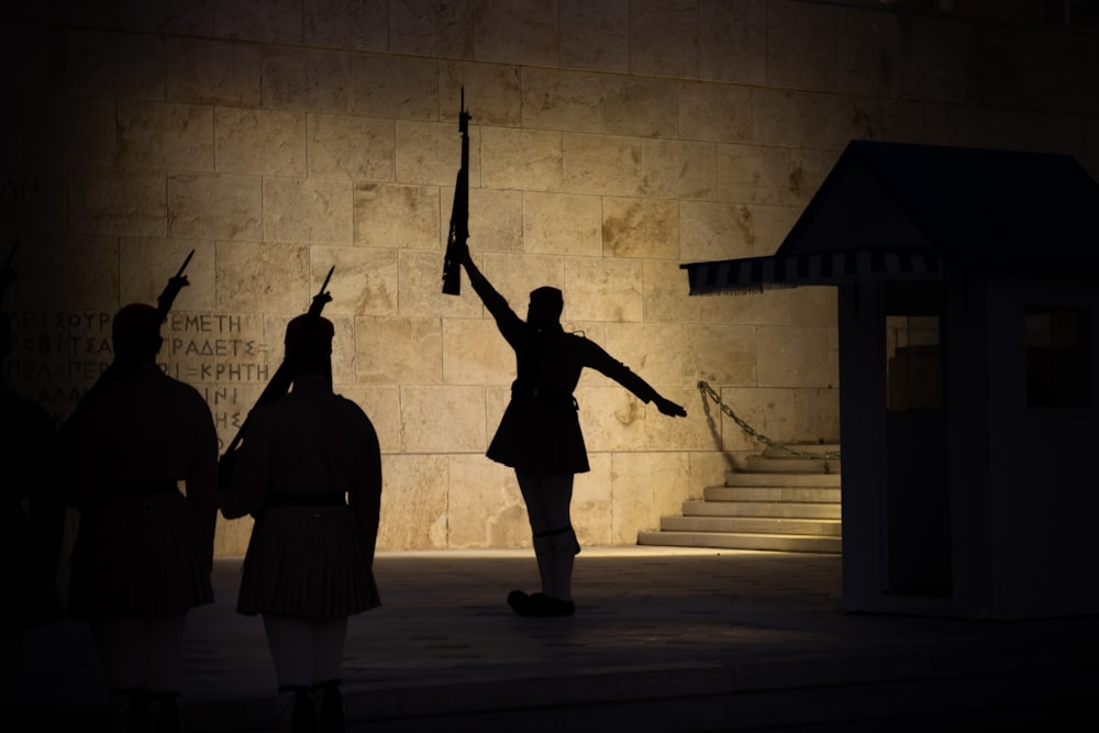 a silhouette of a woman holding a flag