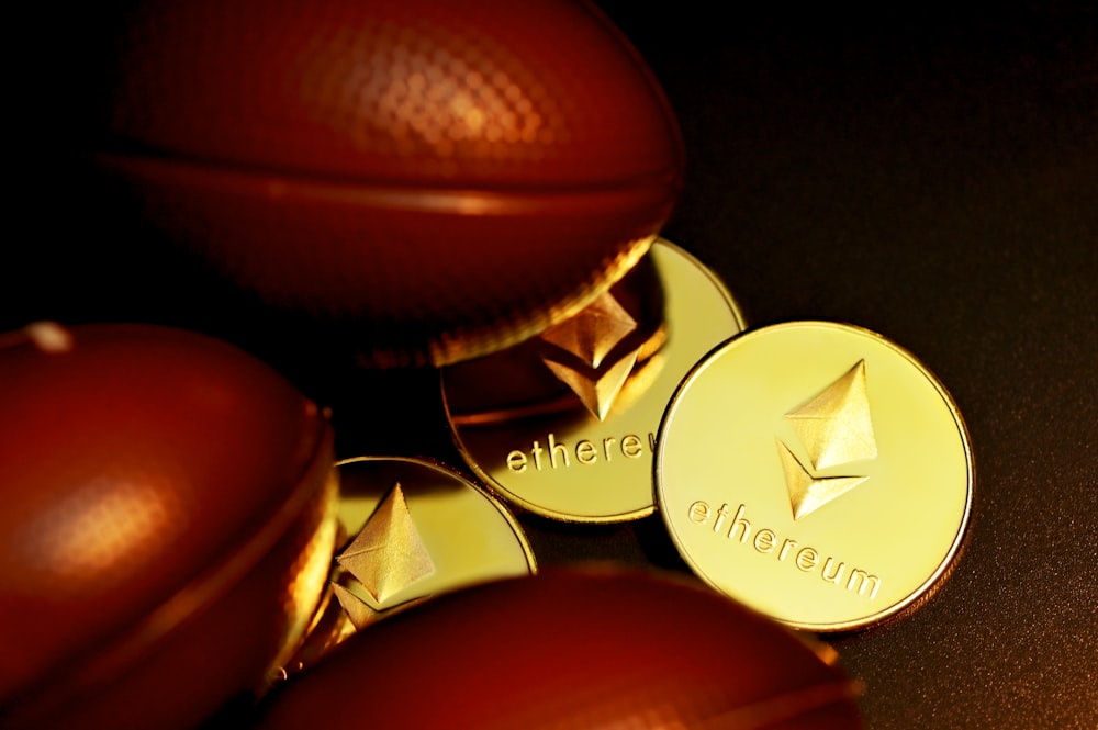 a close up of a pile of gold coins