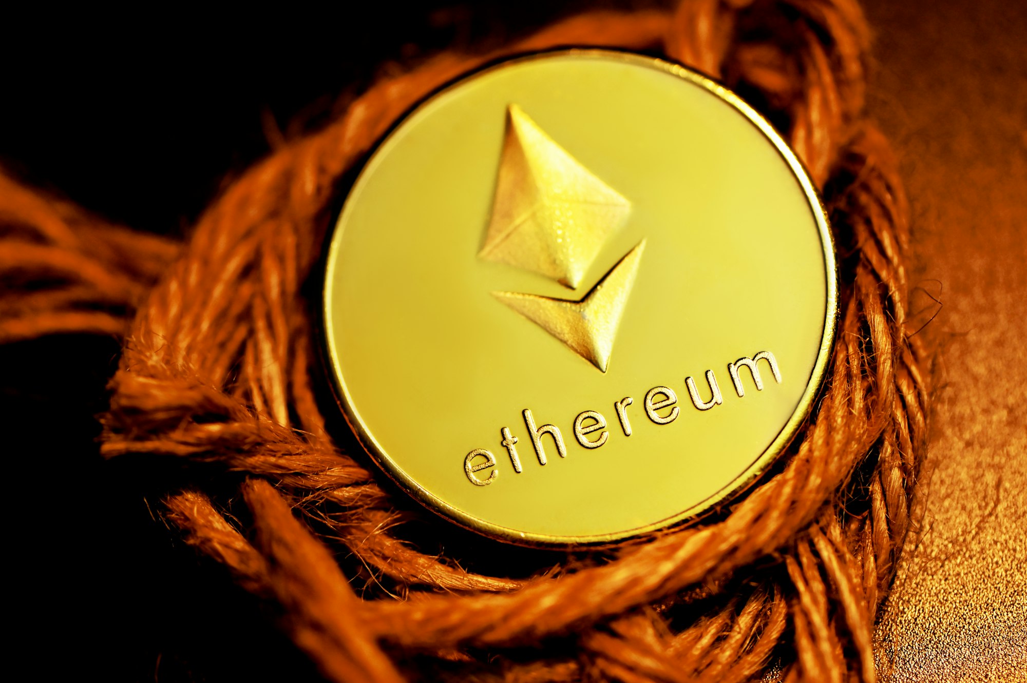 An Ethereum coin on top of a rope