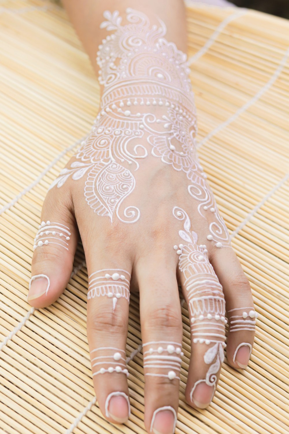 a woman's hand with hennap painted on it