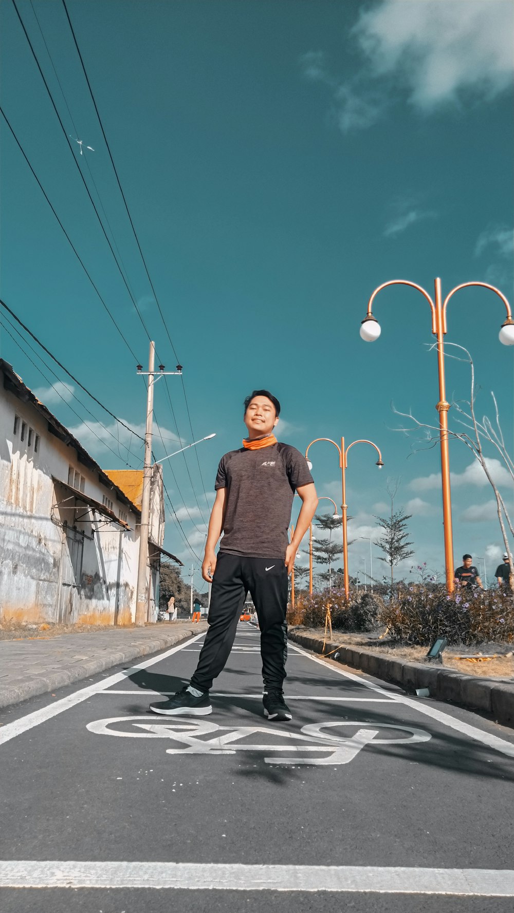 a man standing in the middle of a street