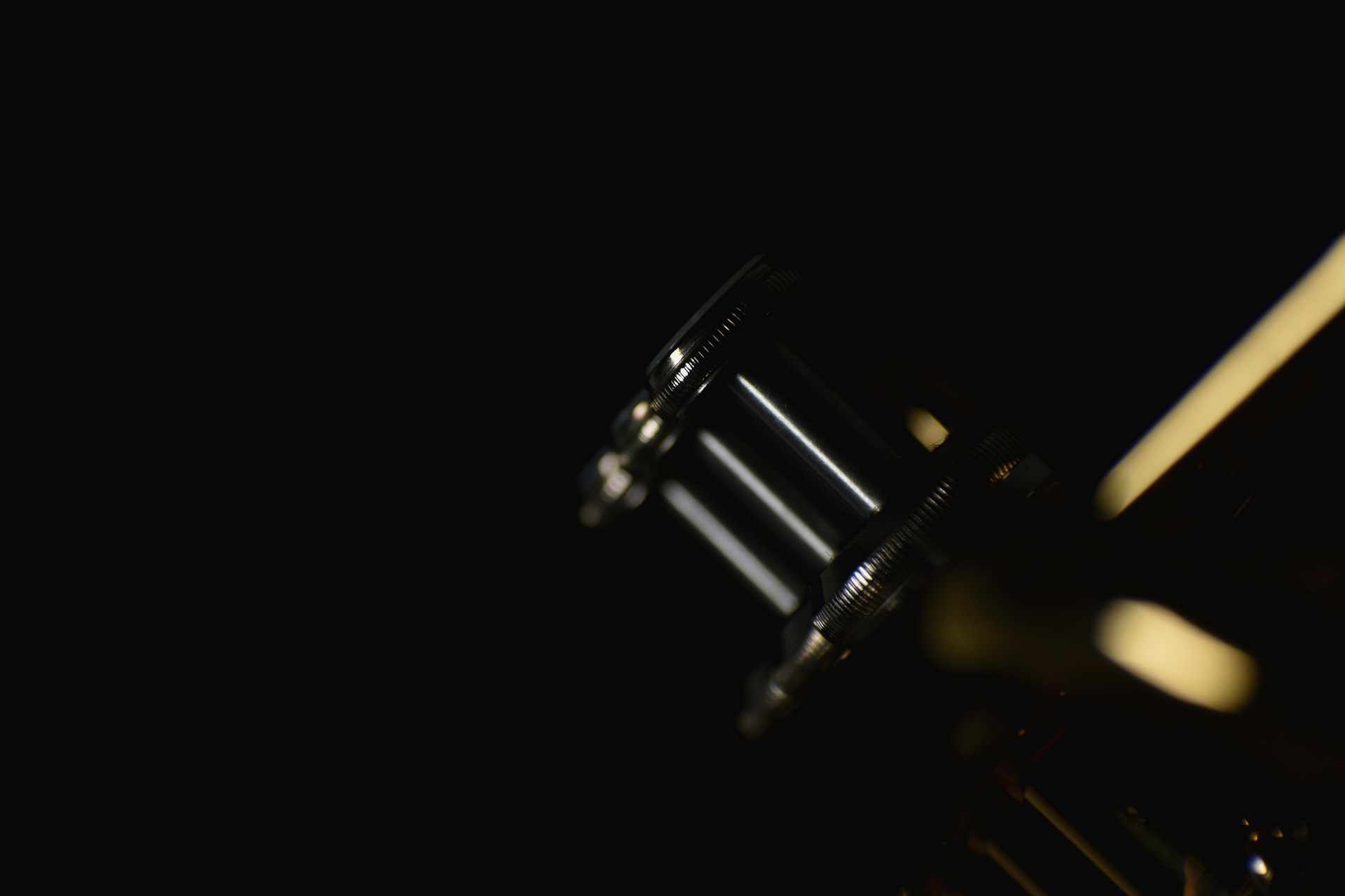 a close up of a metal object in the dark