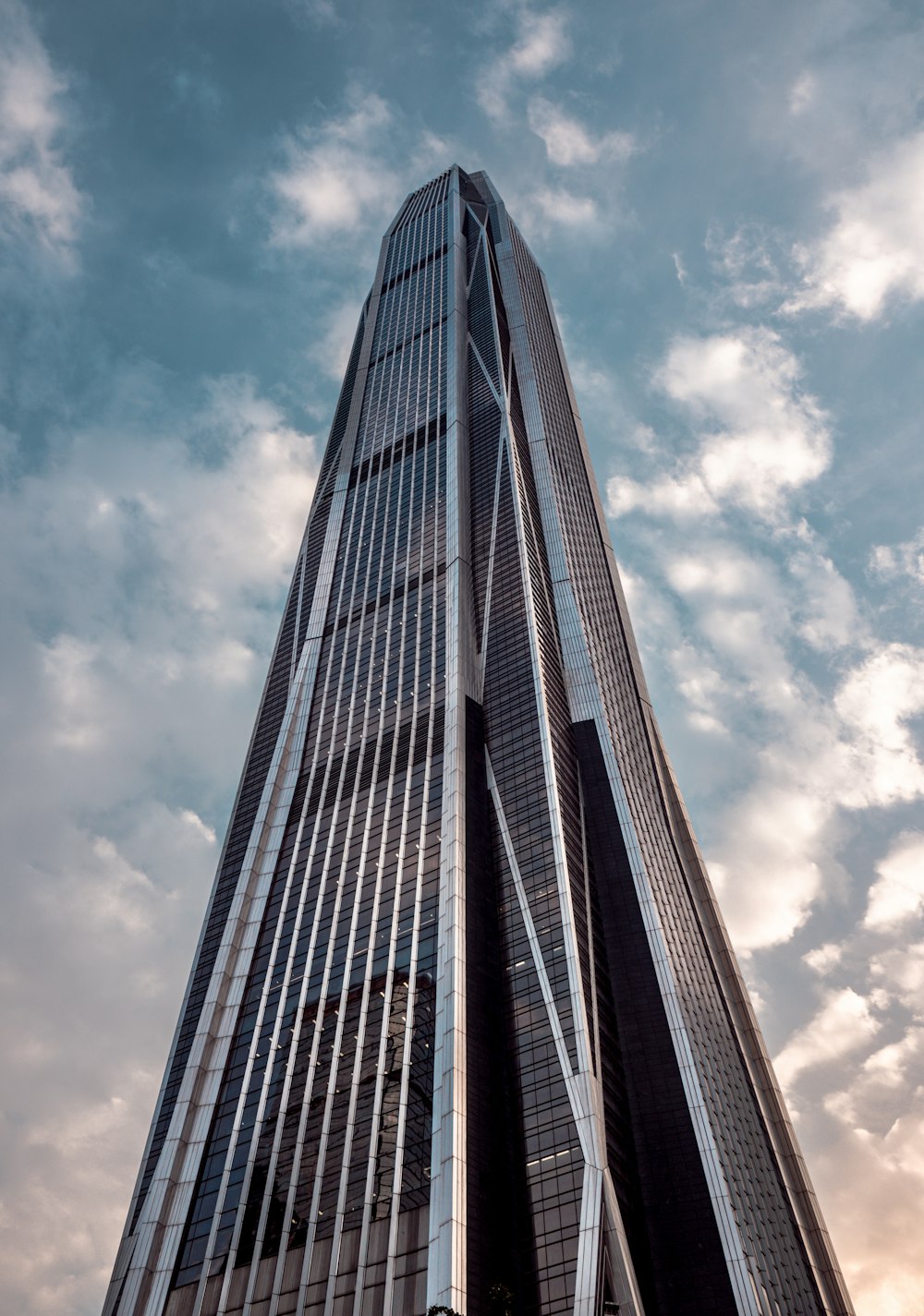 a very tall building with a sky background