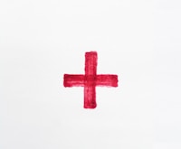 a red cross painted on a white paper