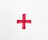 a red cross painted on a white paper