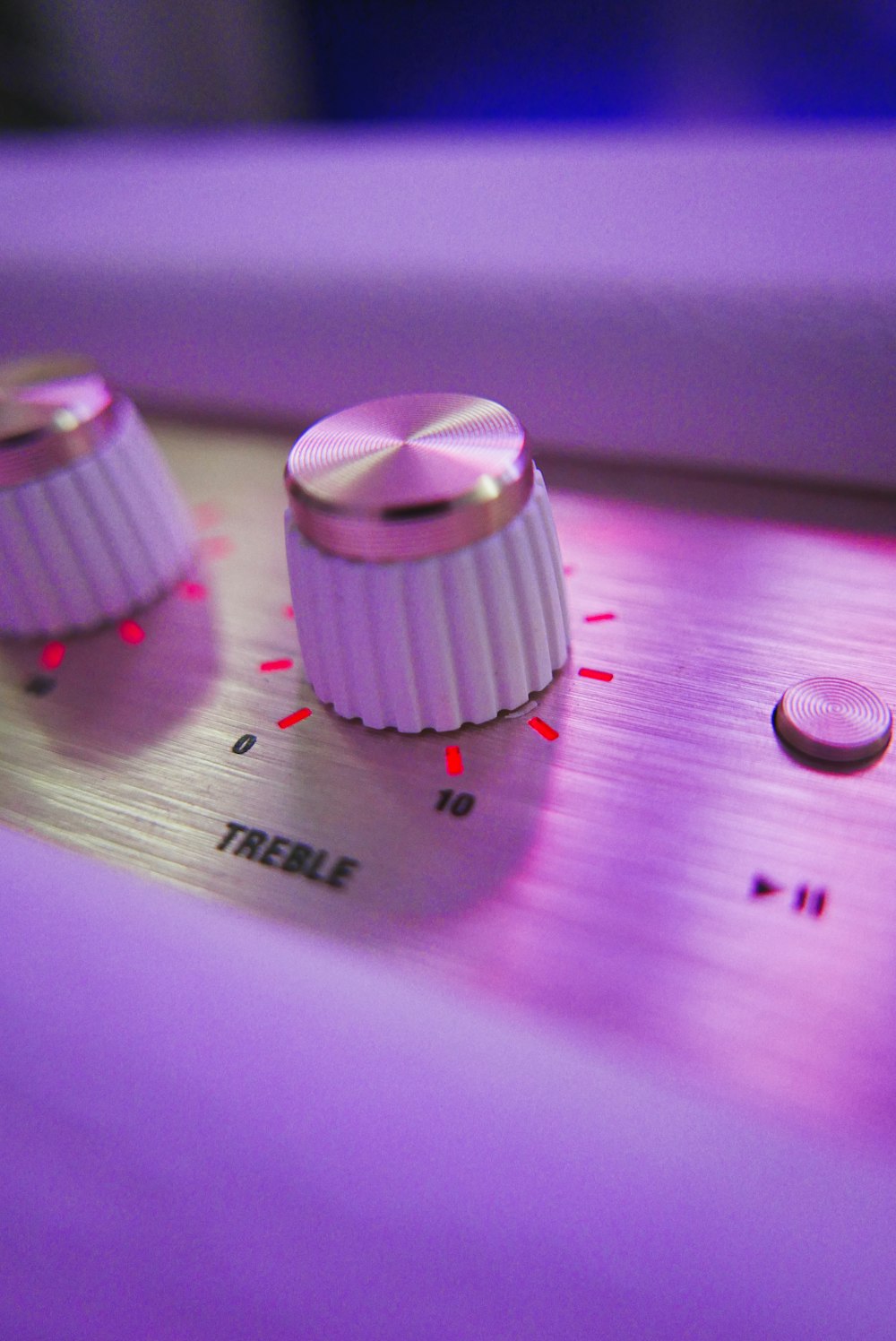 a close up of two knobs on a sound board