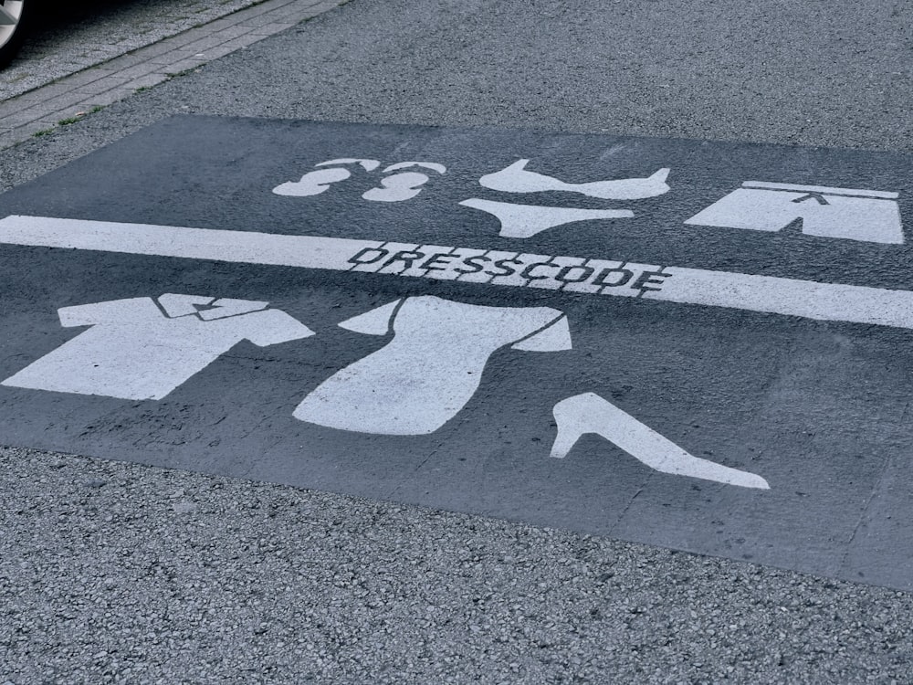 a parking space with a dress code painted on it