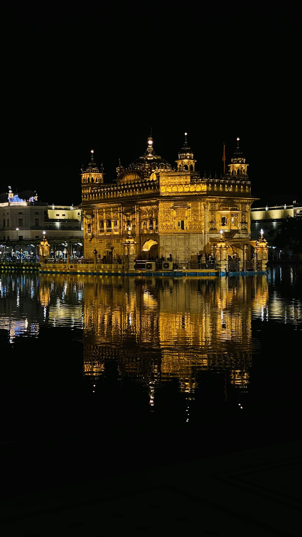 a large building sitting on top of a body of water