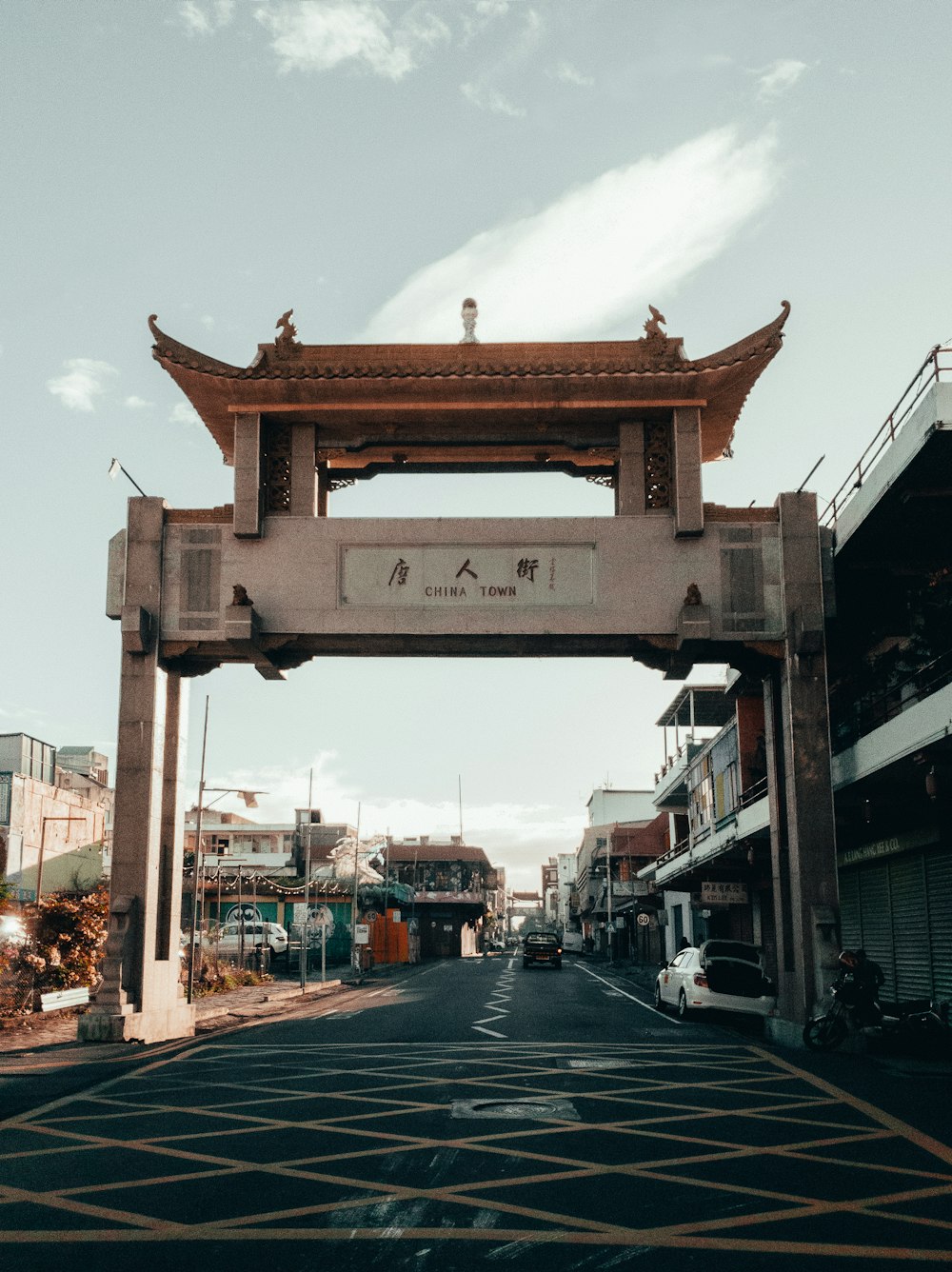 a street with a gate and a sky background