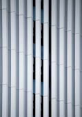 a close up of a building with vertical lines