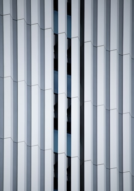 a close up of a building with vertical lines