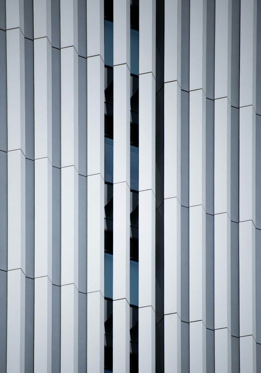a close up of a building with vertical lines