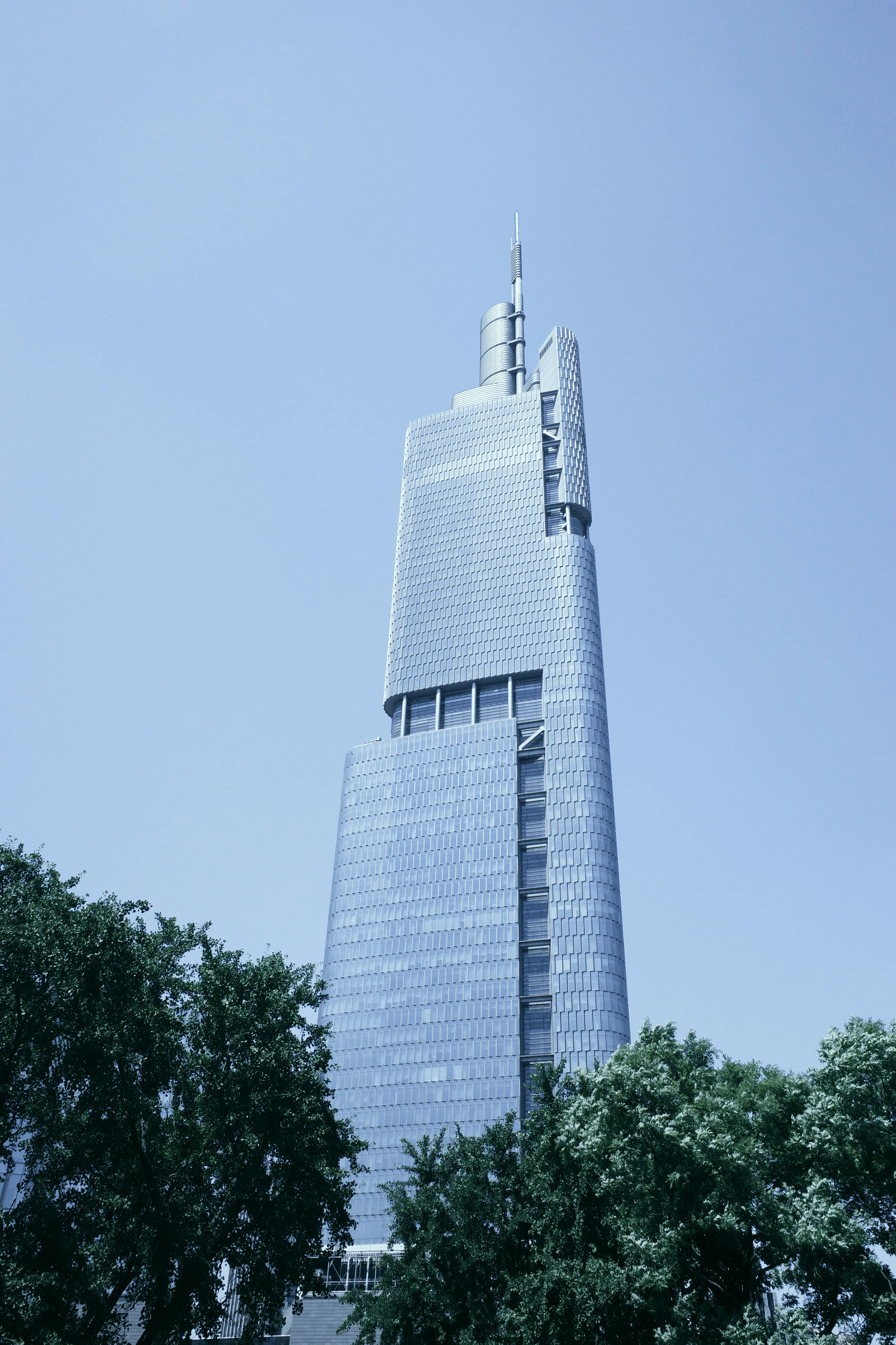 A tall building with a clock on the top of it photo – Free City Image ...
