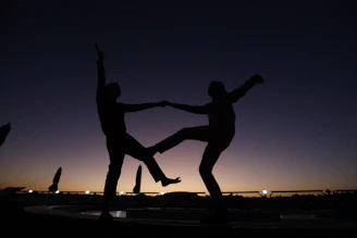 a couple of people standing on top of a fountain