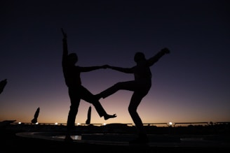 a couple of people standing on top of a fountain