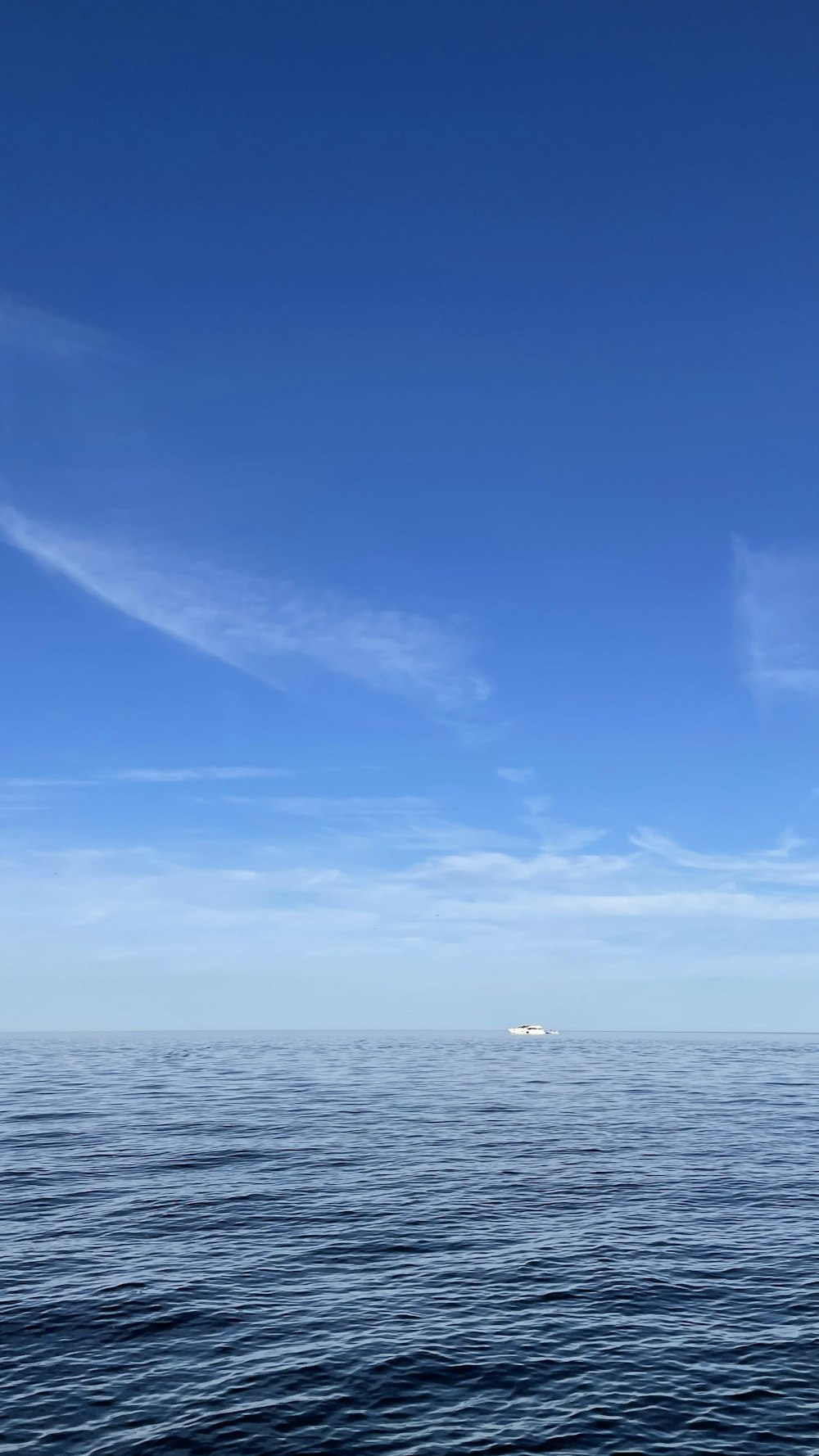 a boat floating on top of a large body of water