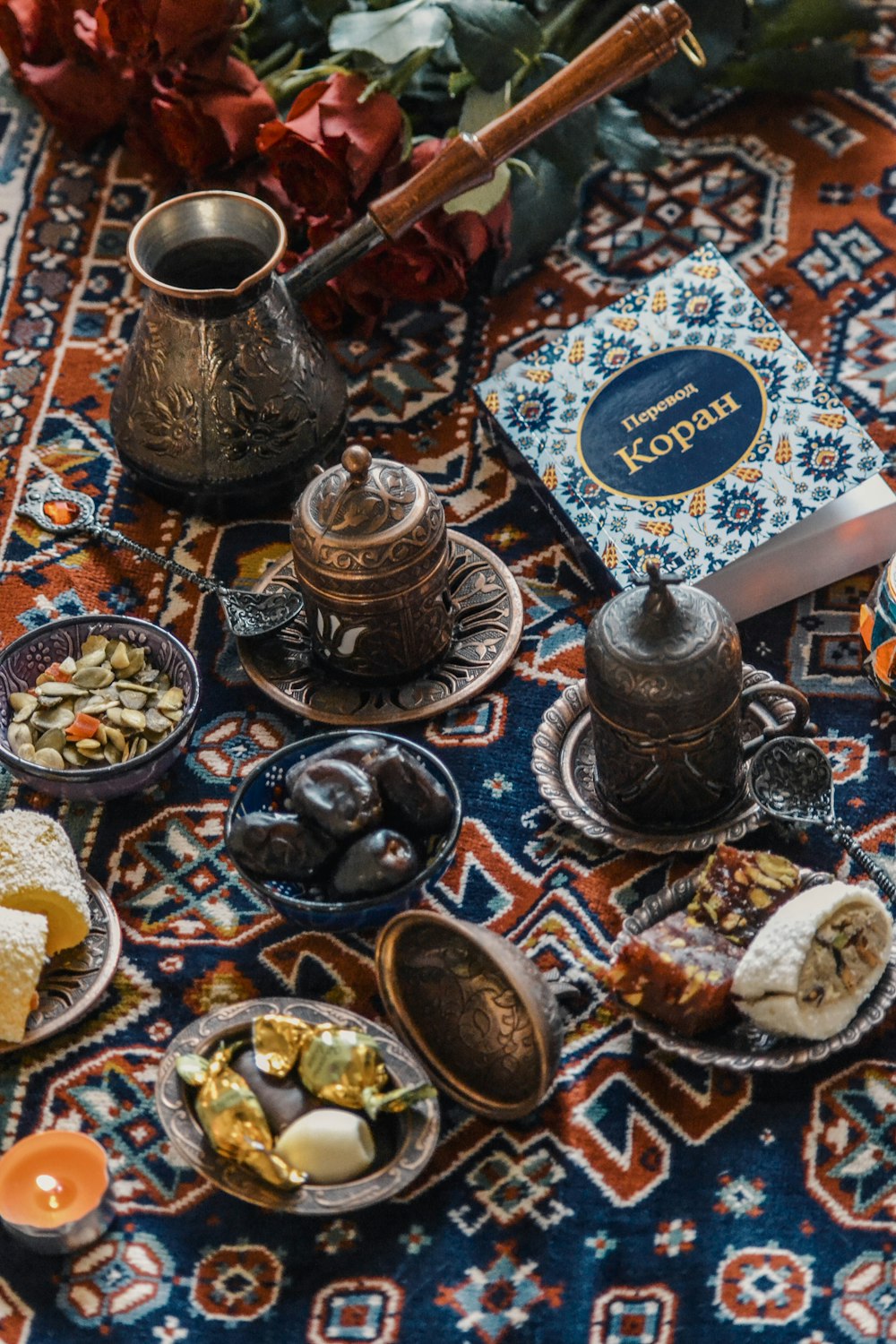 a table topped with plates of food and a book