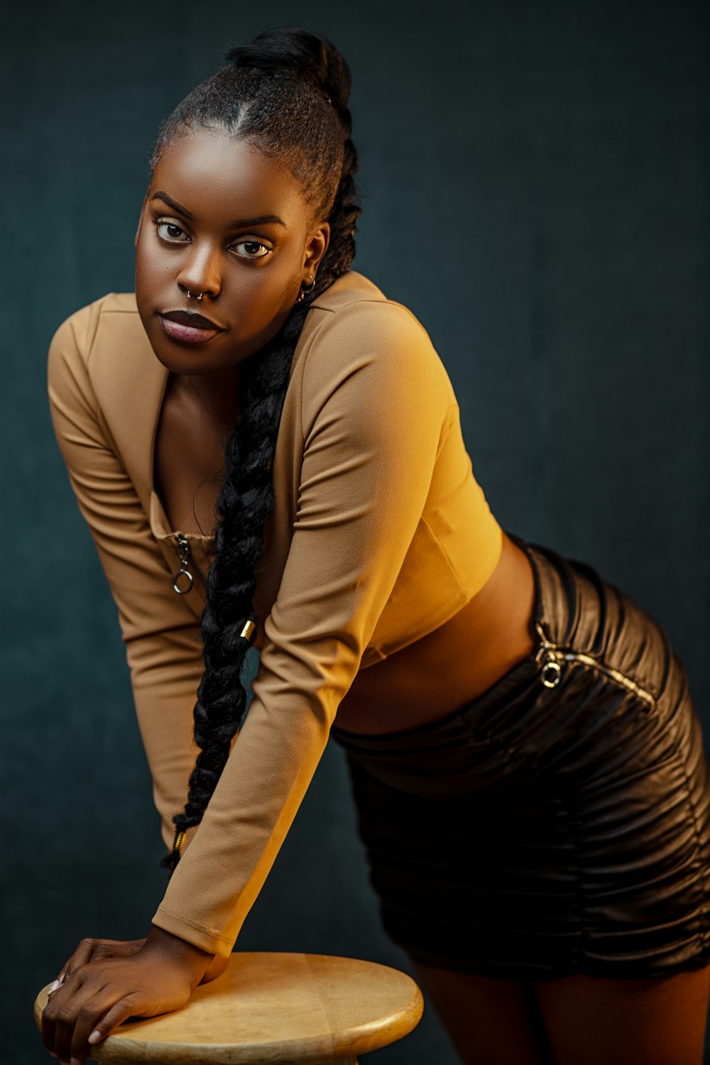 woman in yellow long sleeve shirt and black skirt