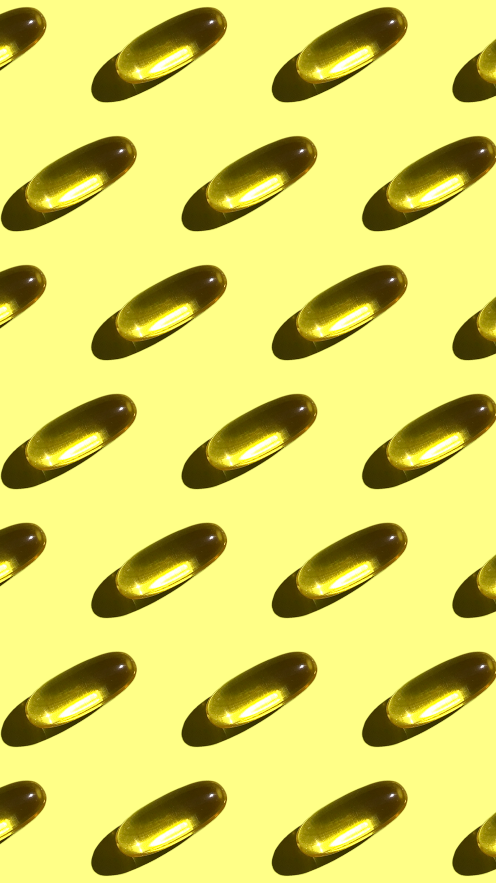 a yellow background with a lot of oval shapes