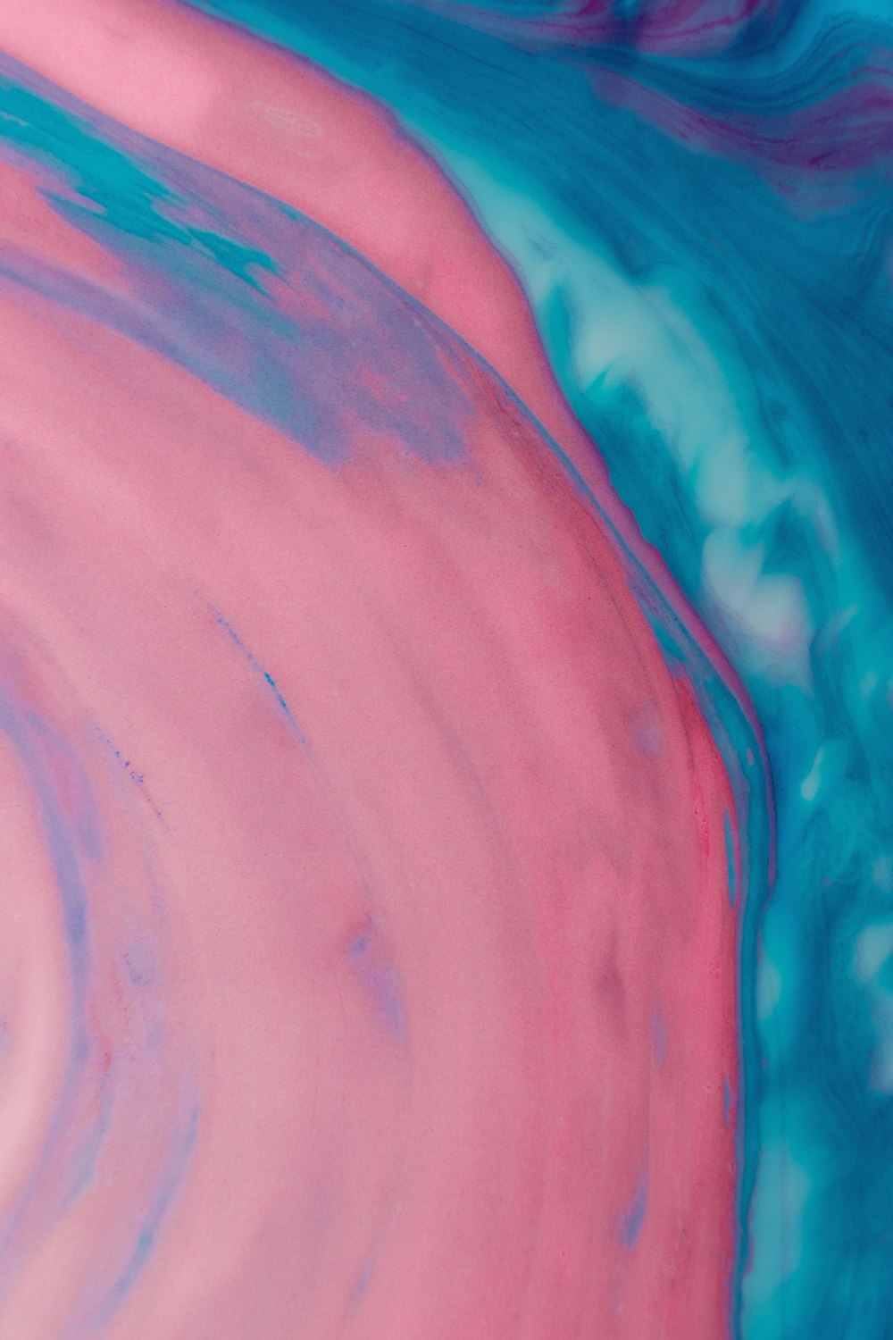a blue and pink painting with a white background