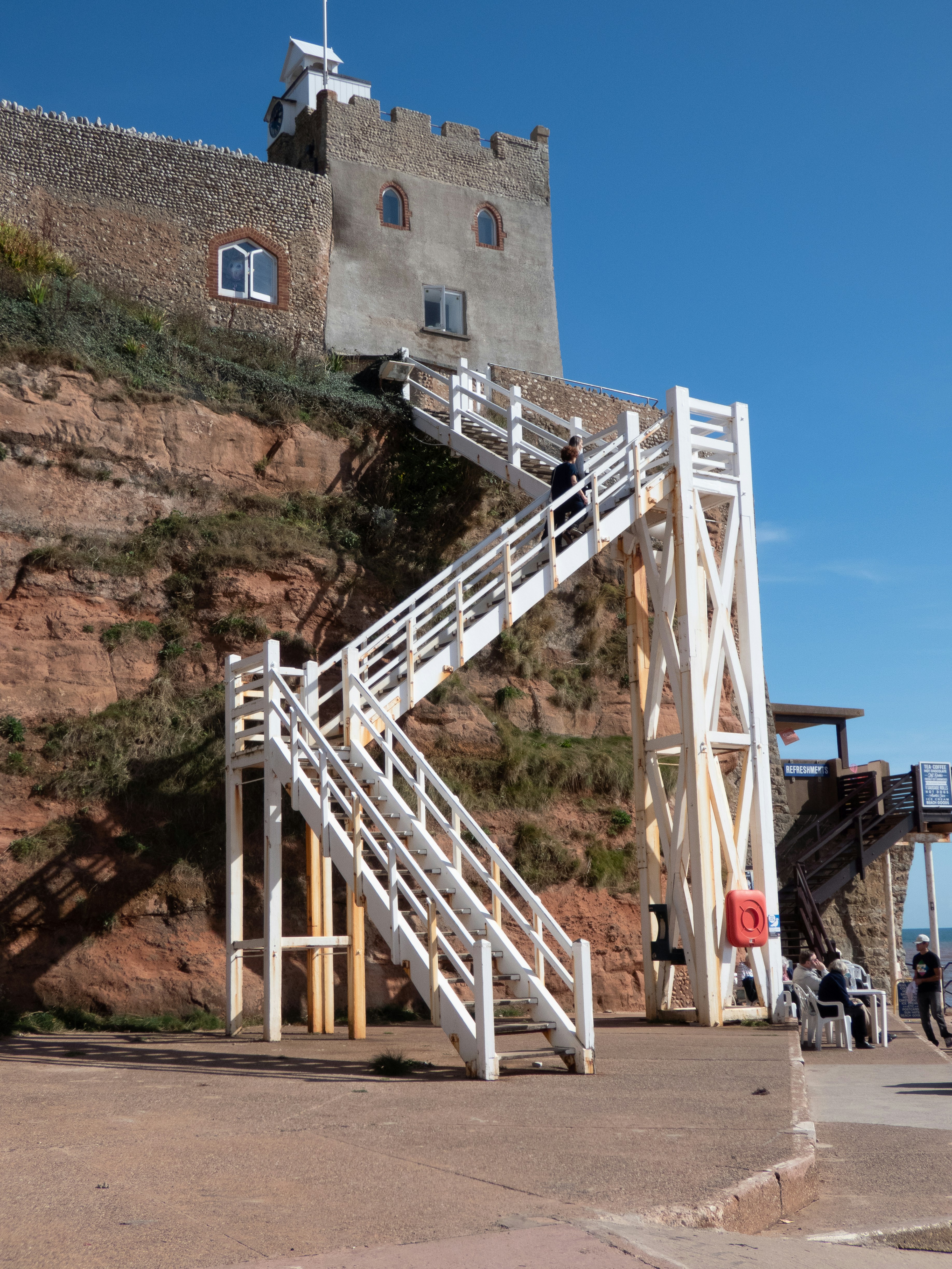 a white staircase leading up to a building