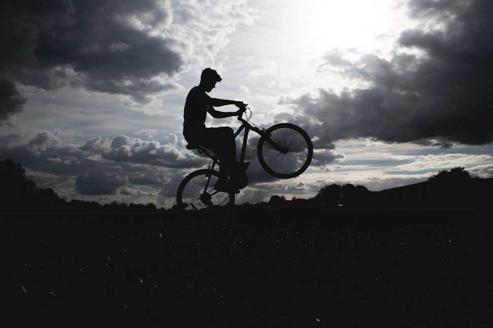a person jumping a bike in the air