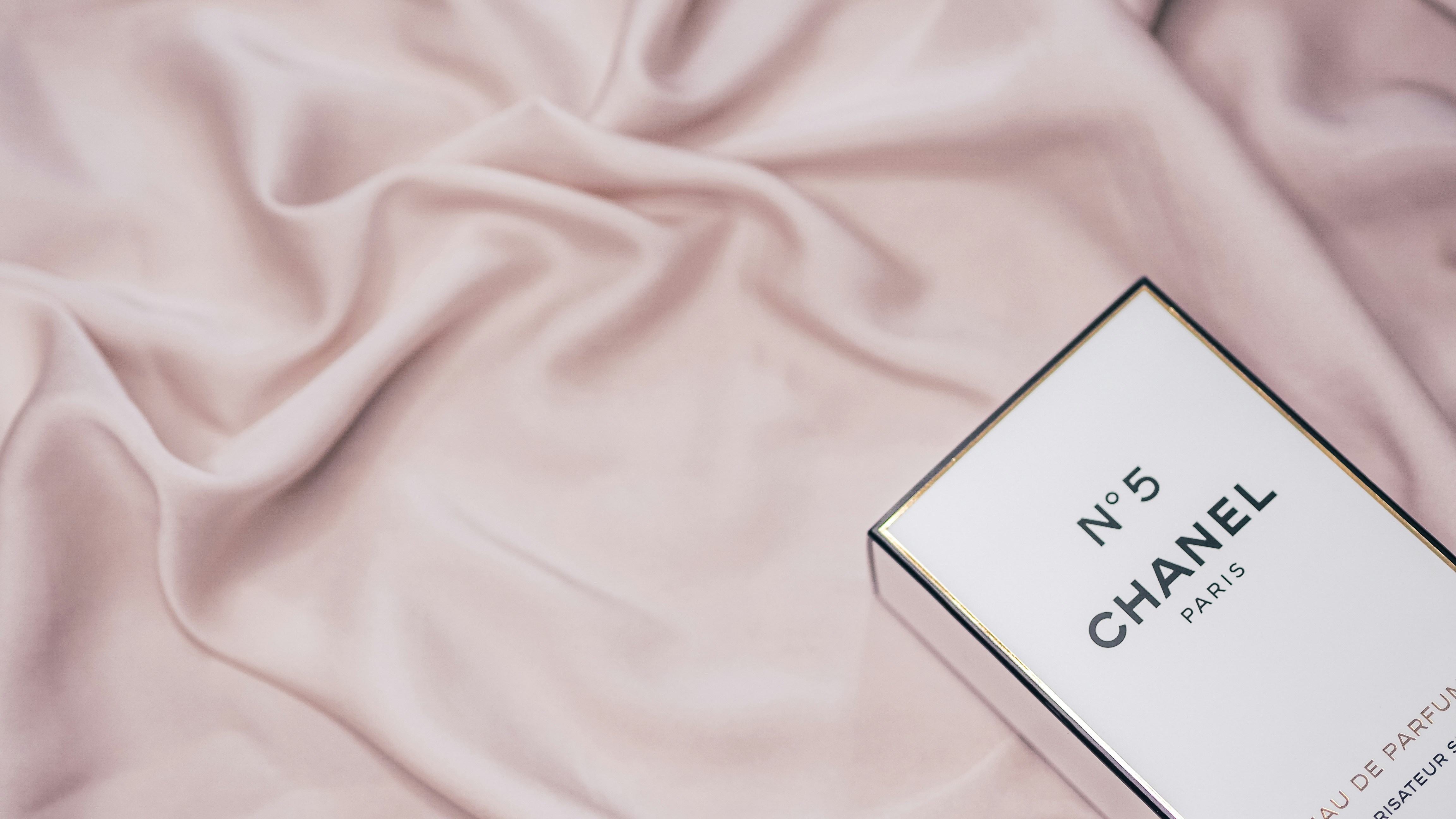 white box on pink textile