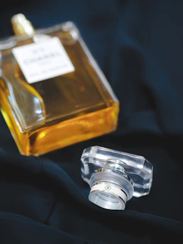 clear glass bottle with gold liquid inside