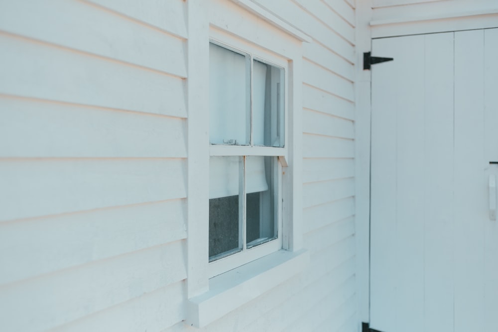 white wooden framed glass window