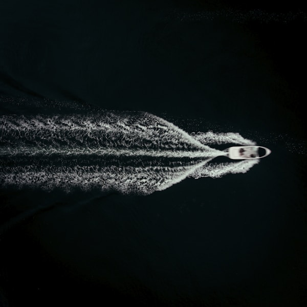 a jet is flying through the air leaving a trail of white smokeby Mads Eneqvist