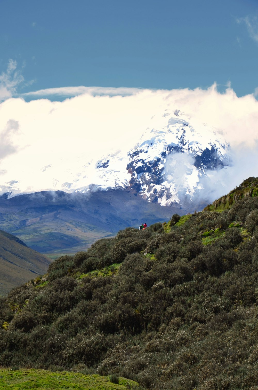 a mountain with a snow capped peak in the distance