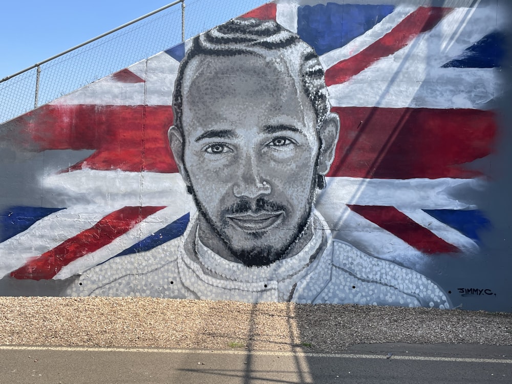 a mural of a man with a british flag in the background