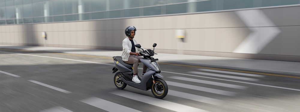 man in white dress shirt riding black motor scooter