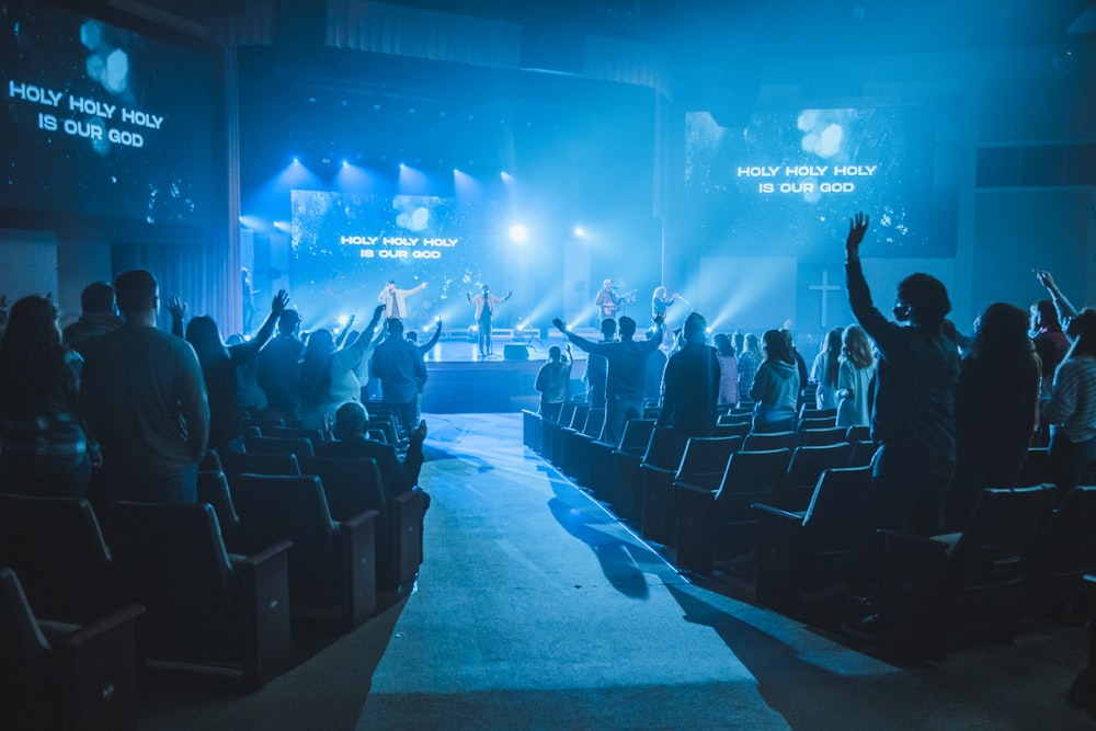 a group of people standing on top of a stage