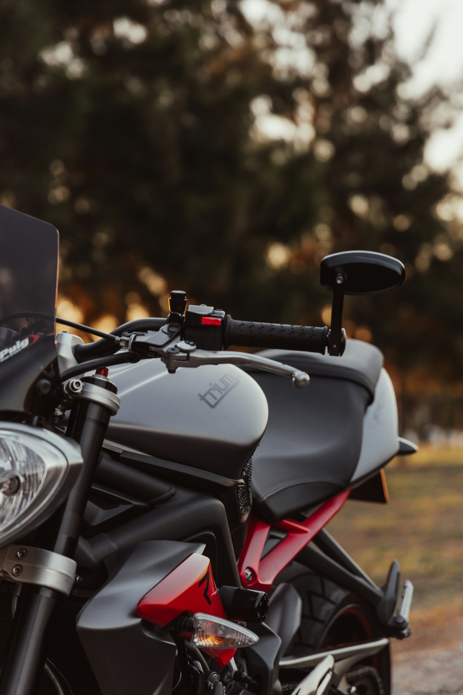 black and gray motorcycle on brown field during daytime