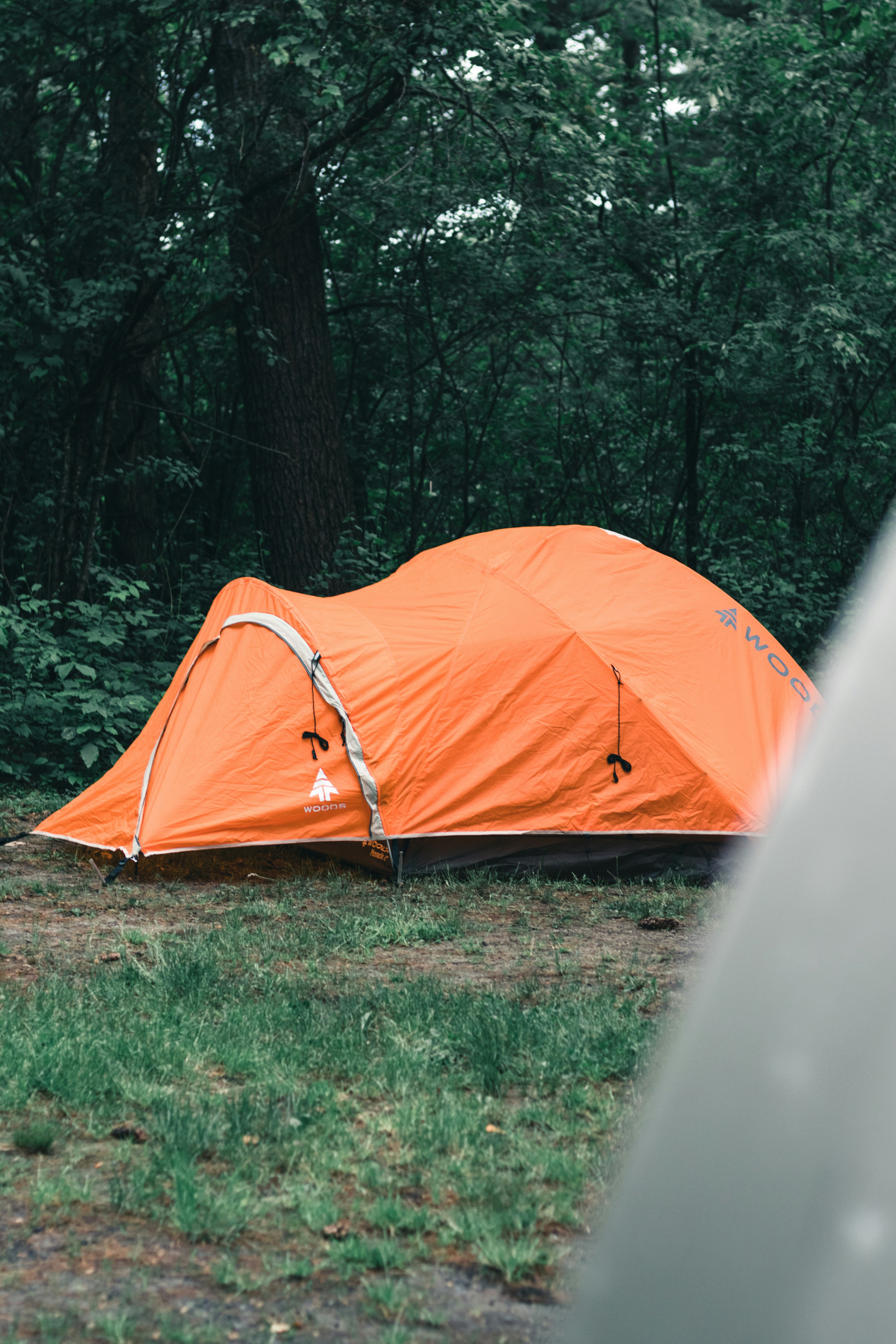 Tall person in tent, ilustrasi artikel Stand Tall: Top Tents for Tall Campers with Extra Headroom 5