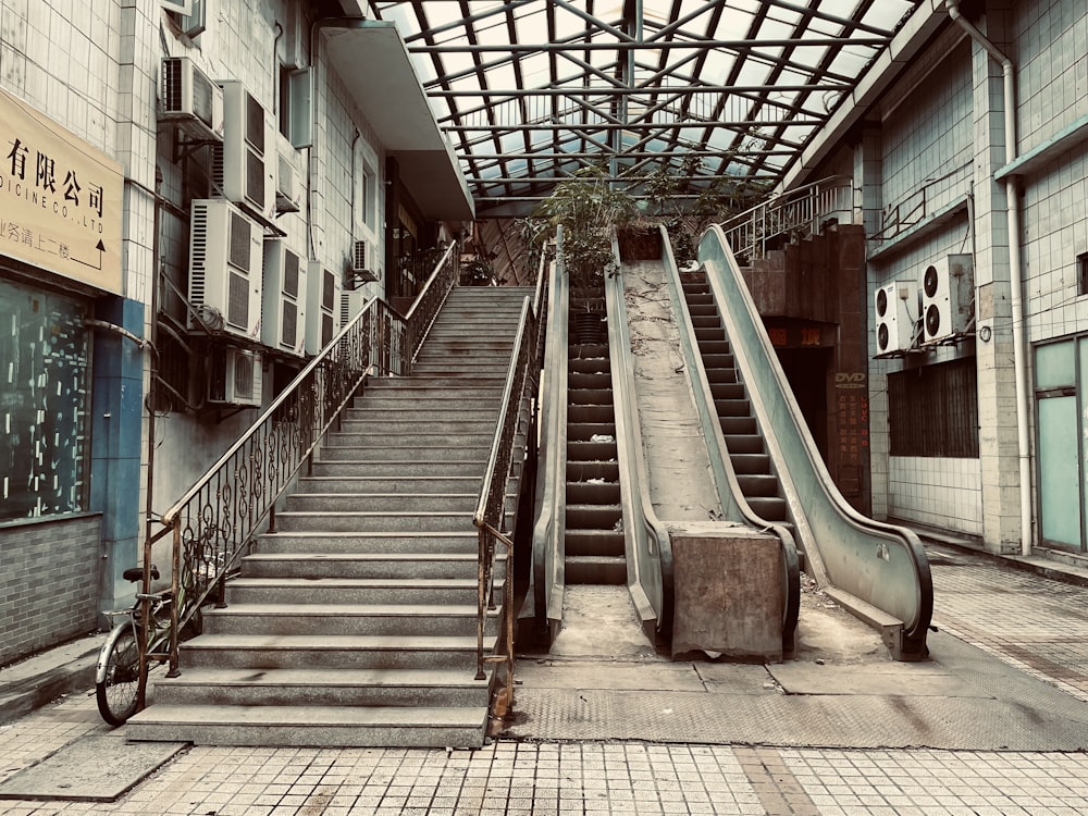 an empty building with a staircase and a bike