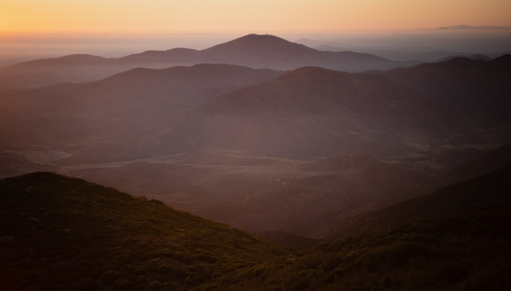 green mountains under white sky during daytime