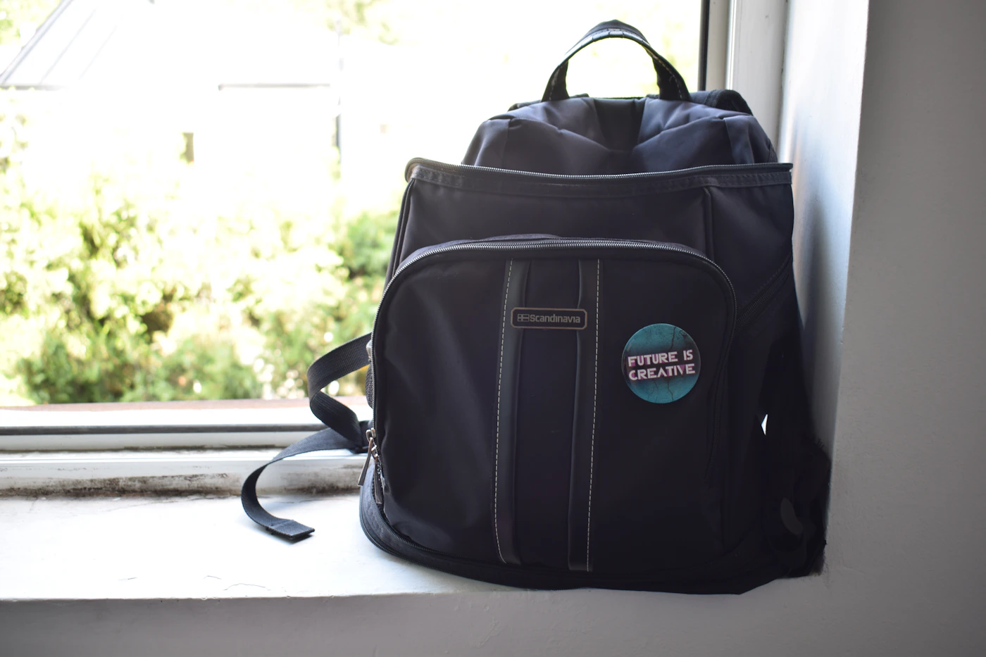 Minimal travel backpack arranged for organized weekend travel