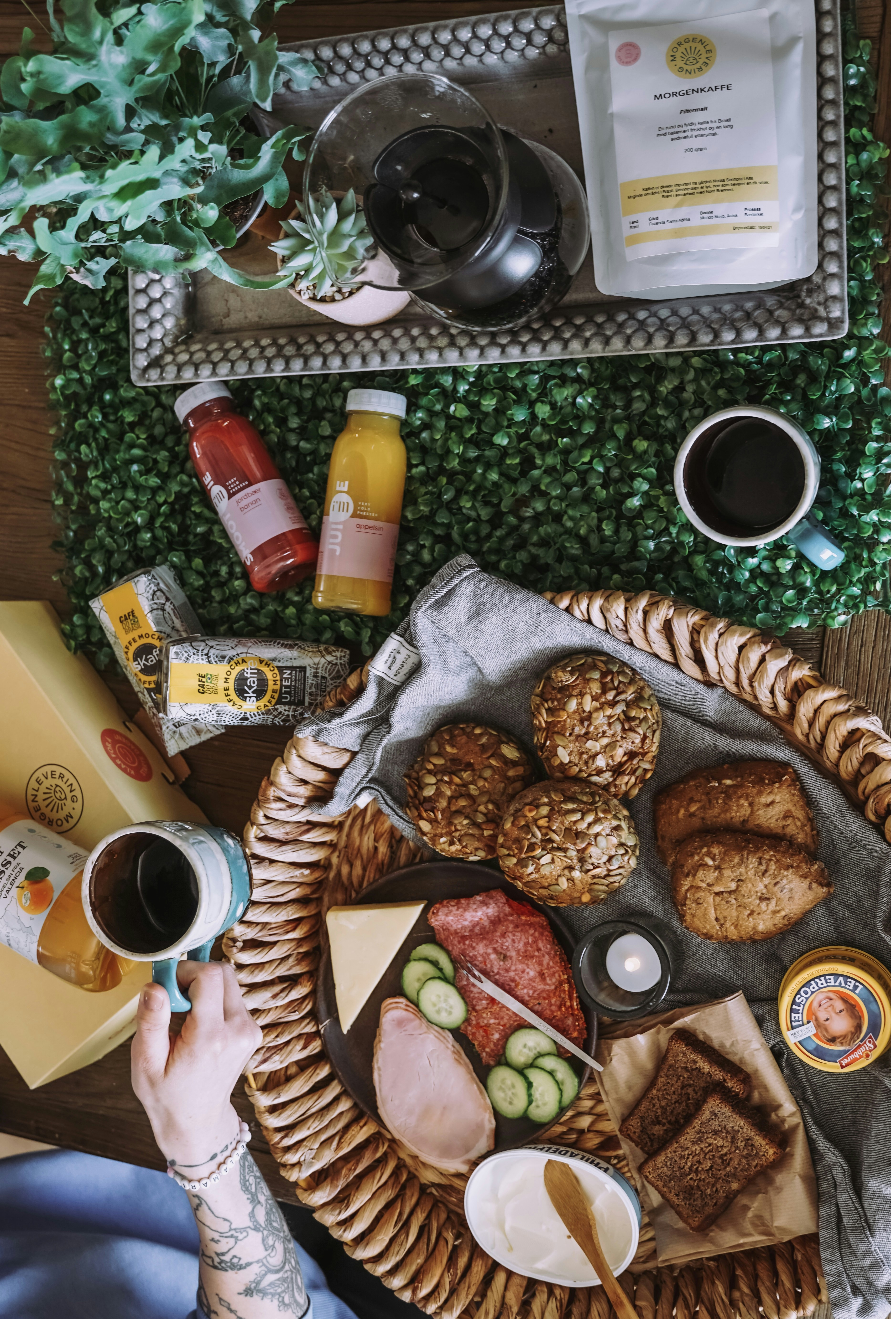 a person sitting at a table with a basket of food