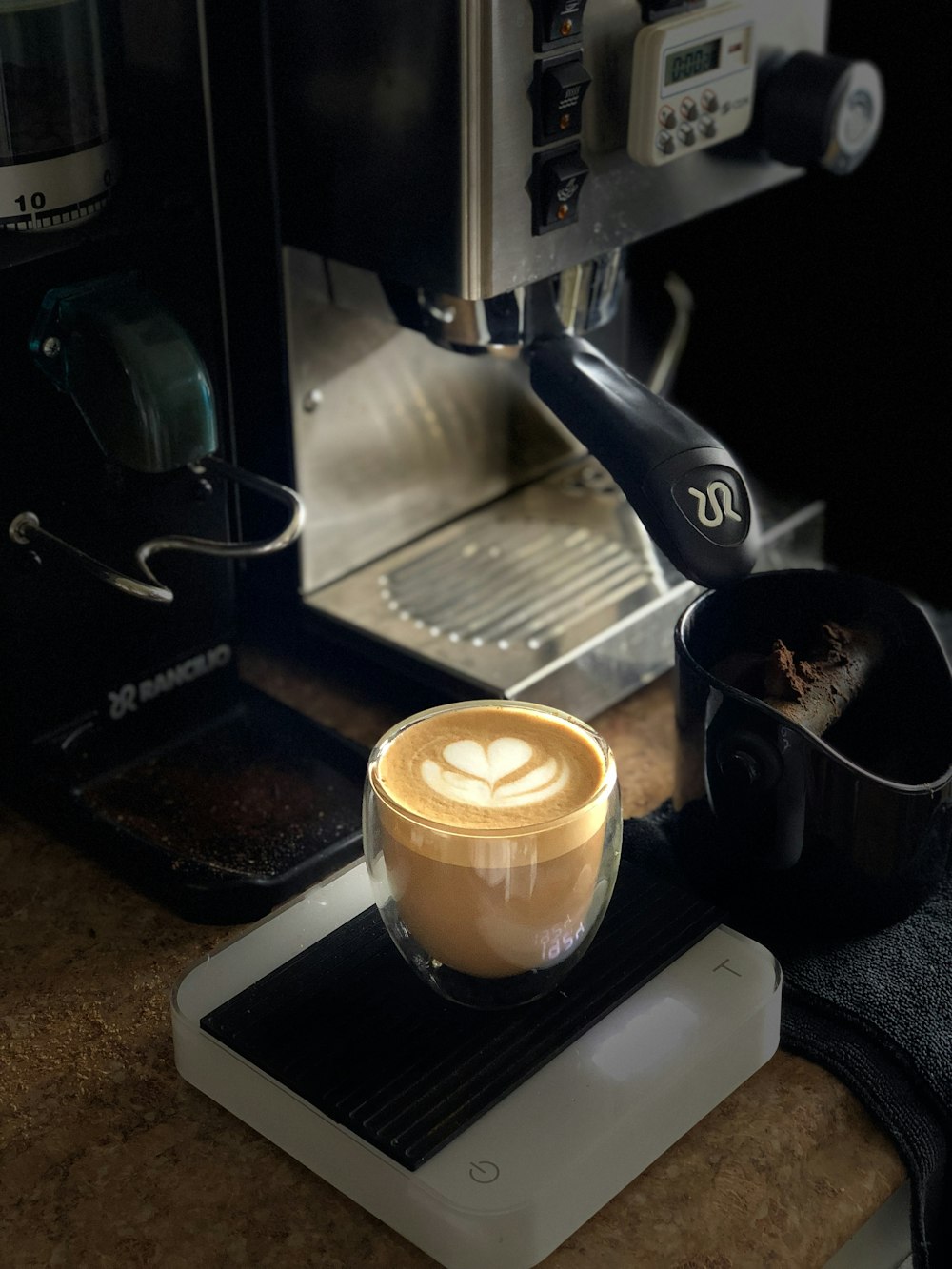 a cup of coffee sitting on top of a counter