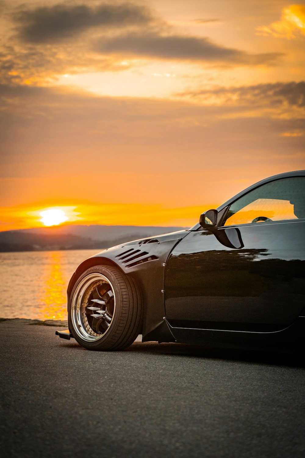 black porsche 911 on road during sunset