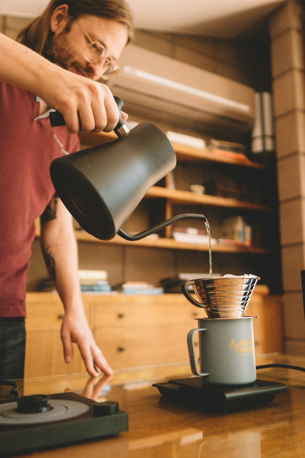 person holding black ceramic mug