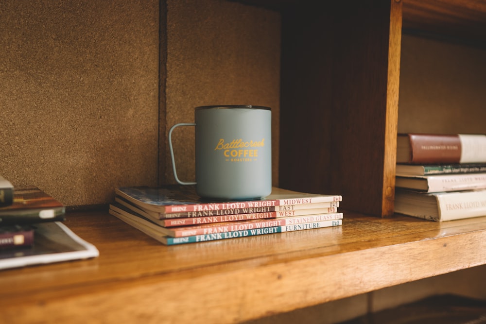 white ceramic mug on brown wooden table