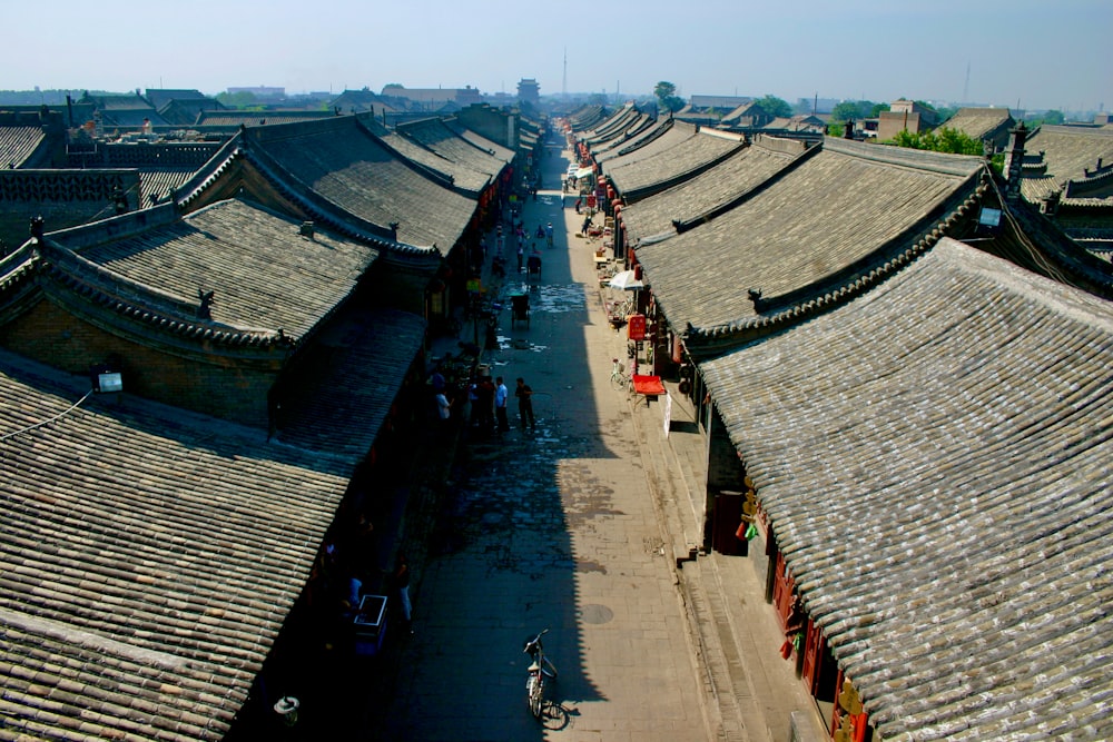 an aerial view of a city with many roofs