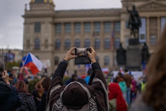 a person taking a picture of a crowd of people